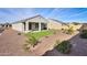 Backyard with artificial turf and xeriscaping provides low-maintenance outdoor living space at 5091 N Bryce Canyon Dr, Eloy, AZ 85131