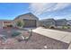 Single-story home with a two-car garage, desert landscaping, and a simple, yet appealing design at 5091 N Bryce Canyon Dr, Eloy, AZ 85131