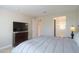 Bedroom featuring a TV, dresser, and en-suite bathroom at 5091 N Bryce Canyon Dr, Eloy, AZ 85131