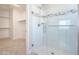 Shower with glass door, tile surround, and mosaic accents at 5091 N Bryce Canyon Dr, Eloy, AZ 85131