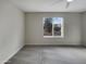 Bedroom featuring a ceiling fan, carpet floors, and a window view of outside at 5432 E Juniper Ave, Scottsdale, AZ 85254