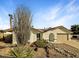 Charming single-story home featuring desert landscaping, red tile roof, and an attached two-car garage at 5432 E Juniper Ave, Scottsdale, AZ 85254