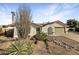 Charming single-story home featuring desert landscaping, red tile roof, and an attached two-car garage at 5432 E Juniper Ave, Scottsdale, AZ 85254