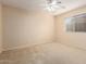 Comfortable bedroom featuring neutral decor and a window offering natural light at 6060 W Charter Oak Rd, Glendale, AZ 85304