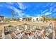 Spacious backyard features a fire pit with seating and picturesque landscaping, creating a relaxing outdoor retreat at 6611 E Peak View Rd, Cave Creek, AZ 85331