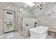 Spa-like bathroom featuring a soaking tub, a glass-enclosed shower, and elegant tile work at 6611 E Peak View Rd, Cave Creek, AZ 85331