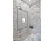 Elegant shower with marble tile, decorative tilework, and a mosaic-tiled floor at 6611 E Peak View Rd, Cave Creek, AZ 85331