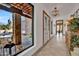 Bright foyer featuring tiled floors, a view to the front yard, and a decorative console with a view to the front entrance at 6611 E Peak View Rd, Cave Creek, AZ 85331