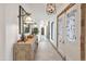 Elegant foyer with a decorative mirror, unique lighting fixtures, and a stylish console table, setting a sophisticated tone at 6611 E Peak View Rd, Cave Creek, AZ 85331