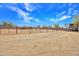 Large, sandy fenced area with metal fencing and desert vegetation, perfect for horses or livestock at 6611 E Peak View Rd, Cave Creek, AZ 85331