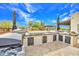 Outdoor kitchen features a grill, and ample counter space, perfect for preparing meals while enjoying the outdoor scenery at 6611 E Peak View Rd, Cave Creek, AZ 85331