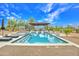 Inviting pool area featuring a sparkling pool, spa, and shaded cabana, perfect for outdoor relaxation and entertainment at 6611 E Peak View Rd, Cave Creek, AZ 85331