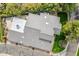 An aerial view of the home's roof, driveway and well-manicured lawn surrounded by lush greenery at 6801 N 1St Pl, Phoenix, AZ 85012