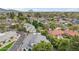 An aerial view of the property and surrounding neighborhood with lush greenery and mountain views at 6801 N 1St Pl, Phoenix, AZ 85012