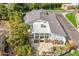 Aerial shot of the backyard with a patio, mature trees, and a private outdoor living space at 6801 N 1St Pl, Phoenix, AZ 85012