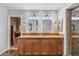 Luxurious bathroom featuring double vanity with granite countertop and a glass-enclosed shower at 6801 N 1St Pl, Phoenix, AZ 85012