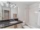 Bathroom features granite countertop with vanity and tiled shower and bath at 6801 N 1St Pl, Phoenix, AZ 85012