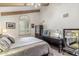 Bedroom features vaulted ceiling with exposed beams and a large window at 6801 N 1St Pl, Phoenix, AZ 85012