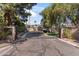 View of a gated entrance featuring brick pillars, providing security and a sense of exclusivity at 6801 N 1St Pl, Phoenix, AZ 85012