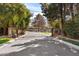 Gated entrance to a home with lush landscaping creating a private and secure environment at 6801 N 1St Pl, Phoenix, AZ 85012