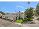 Expansive single-Gathering home with well-maintained landscaping, a circular window, and attached garage at 6801 N 1St Pl, Phoenix, AZ 85012