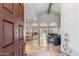 Spacious foyer leading to an open-concept living area, showcasing marble floors and high ceilings at 6801 N 1St Pl, Phoenix, AZ 85012