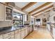 Sun-lit kitchen with granite countertops, stainless appliances, and a large window above the sink with a great view at 6801 N 1St Pl, Phoenix, AZ 85012