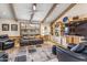 Cozy living room with vaulted ceiling, exposed wood beams and comfortable leather seating at 6801 N 1St Pl, Phoenix, AZ 85012