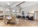 Expansive living room with travertine floors, a vaulted ceiling, and an open floor plan at 6801 N 1St Pl, Phoenix, AZ 85012