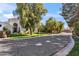 Elegant home with a circular driveway, verdant landscaping, and gated entrance offering privacy at 6801 N 1St Pl, Phoenix, AZ 85012