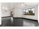 Bright and airy living room with a large window overlooking the neighborhood at 7601 E Roosevelt St # 1007, Scottsdale, AZ 85257