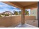 Cozy patio with partial views of the community, with a low brick retaining wall at 7601 E Roosevelt St # 1007, Scottsdale, AZ 85257