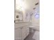 Well-lit bathroom featuring modern fixtures, bathtub, and a unique decorative window at 7755 E Thomas Rd # 8, Scottsdale, AZ 85251