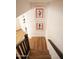 Stairway with wood-look flooring leading up to the second level at 7755 E Thomas Rd # 8, Scottsdale, AZ 85251