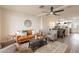 Stylish living room with a comfortable brown sofa, ceiling fan, and an open layout to the kitchen at 7801 N 44Th Dr # 1059, Glendale, AZ 85301