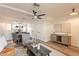 Bright and airy living room with wood floors, leading to dining area and modern furnishings at 7801 N 44Th Dr # 1059, Glendale, AZ 85301