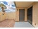 Enclosed patio with gravel landscaping, painted floor, and view of a satellite dish at 7801 N 44Th Dr # 1059, Glendale, AZ 85301