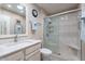 Updated bathroom featuring a glass enclosed shower and modern vanity at 9402 N 109Th Dr, Sun City, AZ 85351