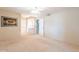 Bright bedroom with neutral carpet and ceiling fan at 9402 N 109Th Dr, Sun City, AZ 85351