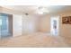 Large bedroom with plush carpeting and ample closet space at 9402 N 109Th Dr, Sun City, AZ 85351