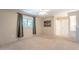 Airy bedroom featuring a window with curtains and plenty of wall space at 9402 N 109Th Dr, Sun City, AZ 85351