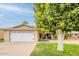 A home with a two car garage and a desert landscape at 9402 N 109Th Dr, Sun City, AZ 85351