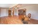 Spacious living room with hardwood floors and vintage sewing machine detail at 9402 N 109Th Dr, Sun City, AZ 85351