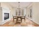 Elegant dining room with a fireplace, chandelier, and access to the patio at 958 S Henry Ln, Gilbert, AZ 85296