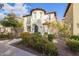 Stunning two-story home with colorful landscaping and a unique turret design at 958 S Henry Ln, Gilbert, AZ 85296