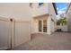 A private brick patio, great for dining al fresco, leading to a dining area through glass doors at 958 S Henry Ln, Gilbert, AZ 85296