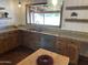 Well-lit kitchen featuring granite countertops, stainless steel appliances, and decorative shelving, creating a modern space at 9620 S 156Th Pl, Gilbert, AZ 85234