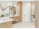 Bright bathroom featuring a modern vanity with stylish mirror and doorway to shower at 9781 E Gamble Ln, Scottsdale, AZ 85262