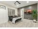 Comfortable bedroom with a simple design, dark accent wall and modern lighting at 9781 E Gamble Ln, Scottsdale, AZ 85262