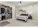 Simple bedroom showcasing an organized walk-in closet with custom shelves and rods at 9781 E Gamble Ln, Scottsdale, AZ 85262